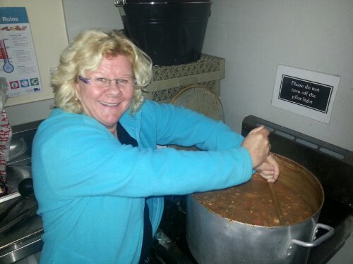 Lyn stirring the stew